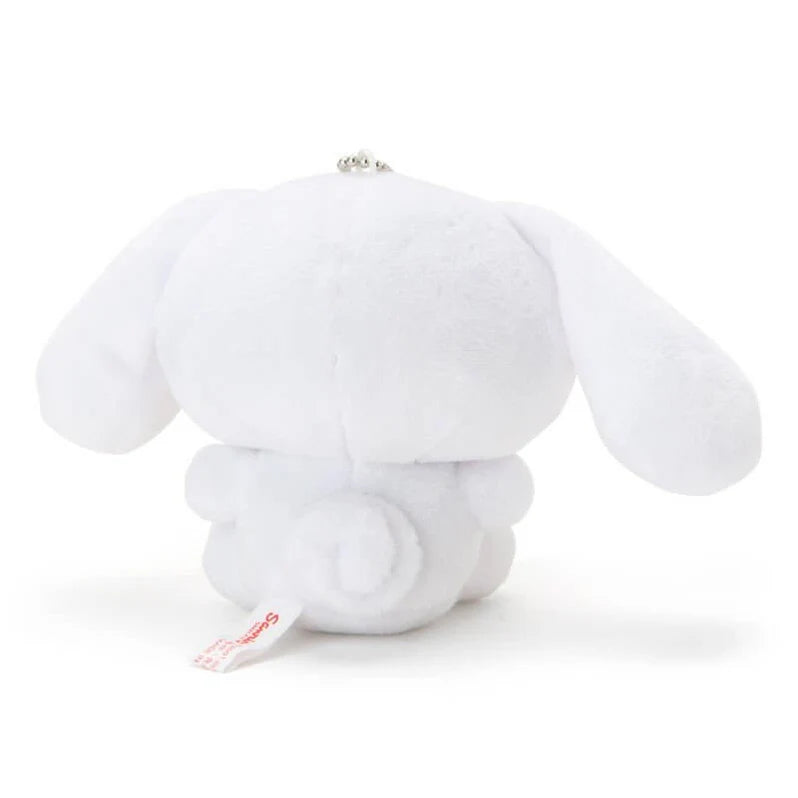 Cinnamoroll puppy mascot holder figure, official Sanrio merchandise for desktop decoration.