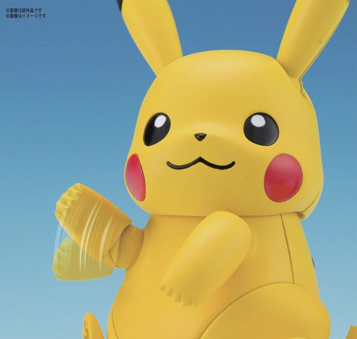 Close-up of the pre-colored plastic runners and stickers included in the Pikachu kit - DARUMA AUSTRALIA PTY LTD