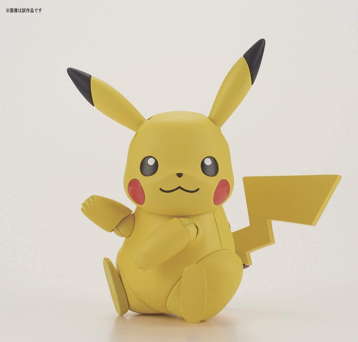 Close-up of the pre-colored plastic runners and stickers included in the Pikachu kit - DARUMA AUSTRALIA PTY LTD