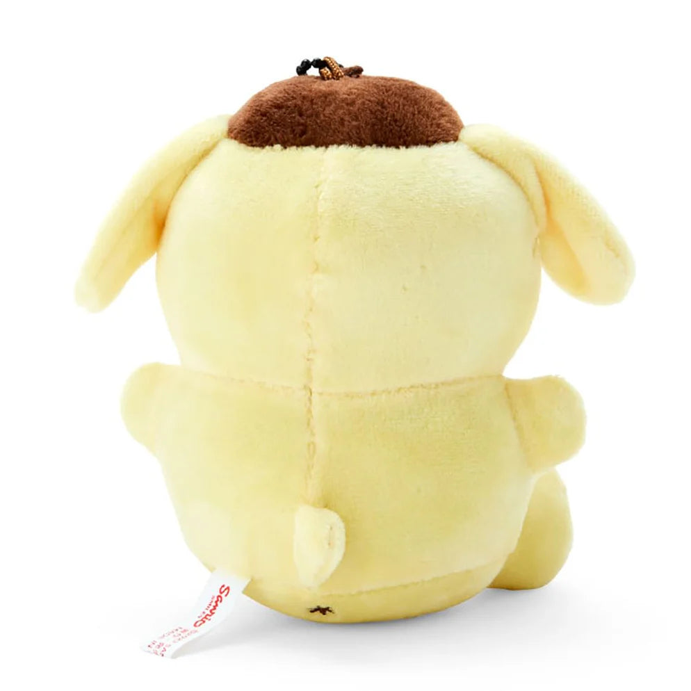 Pompompurin golden retriever mascot holder figure with signature brown beret, official Sanrio merchandise.