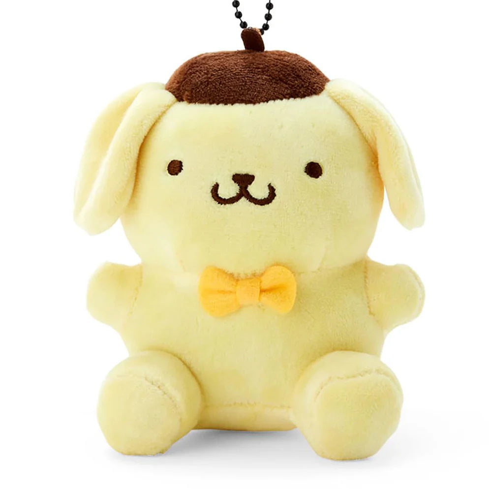 Pompompurin golden retriever mascot holder figure with signature brown beret, official Sanrio merchandise.