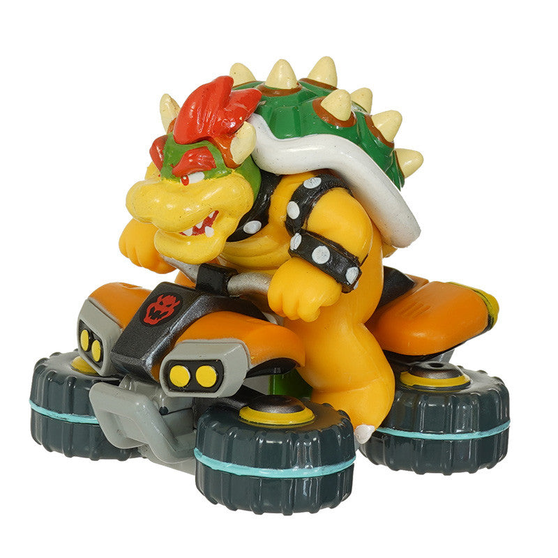 Toy figure of a character with a shell and kart on a white background